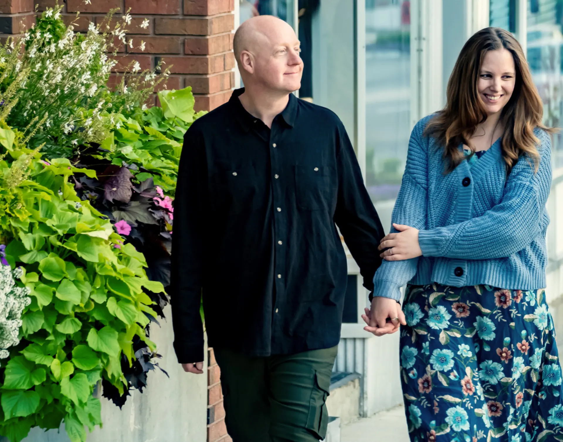 Nate Morris and his wife Emily walking together in downtown Smiths Falls